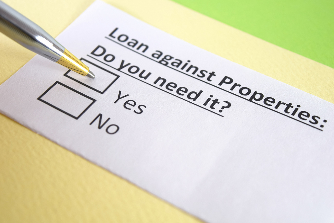 Person discussing loan against properties