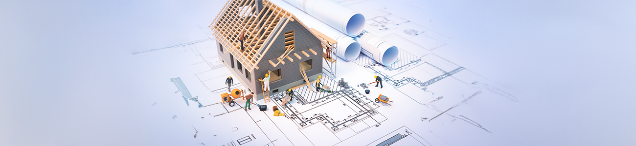 Architect working on blueprints for building self construction house