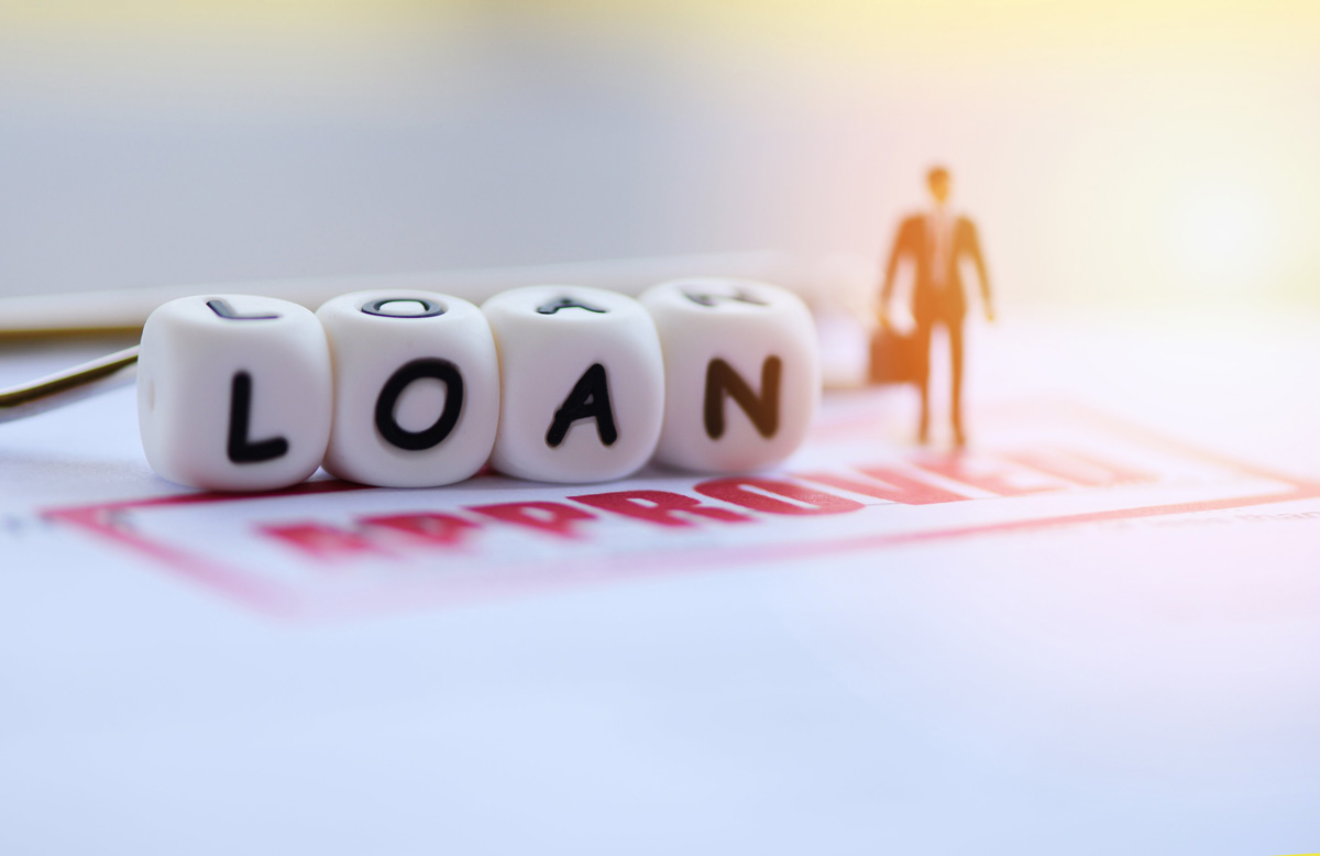 A man standing on a Home Top-Up loan application form