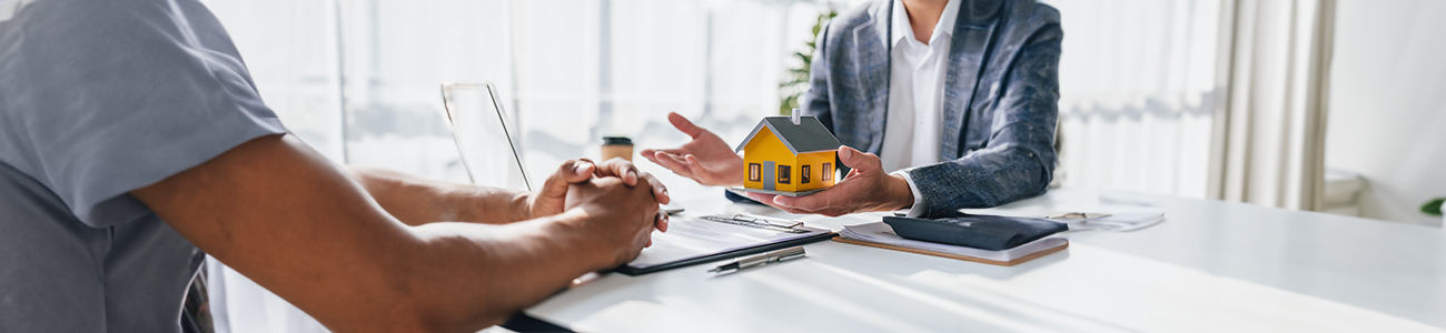 Real estate agent discussing loan against property with client