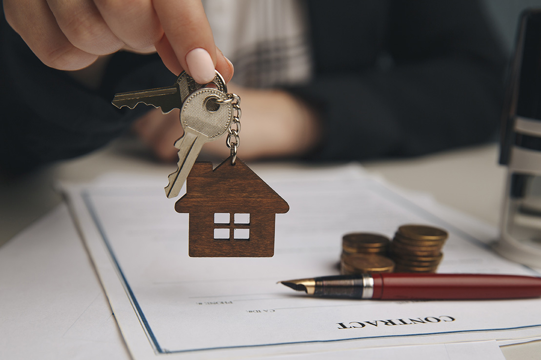 Woman signing home loan agreement for new house