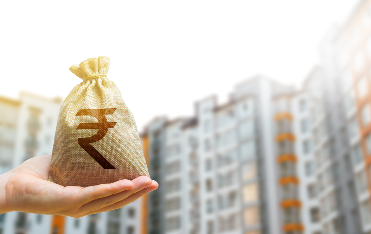 Money bag in front of modern high-rise buildings, symbolizing loan against property